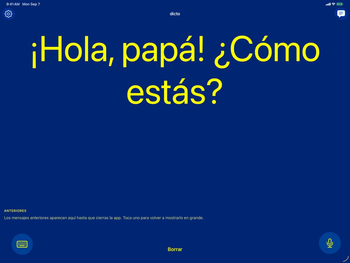 dicto en iPad con la combinación de alto contraste amarillo sobre azul mostrando el mensaje hablado ¡Hola, papá! ¿Cómo estás?